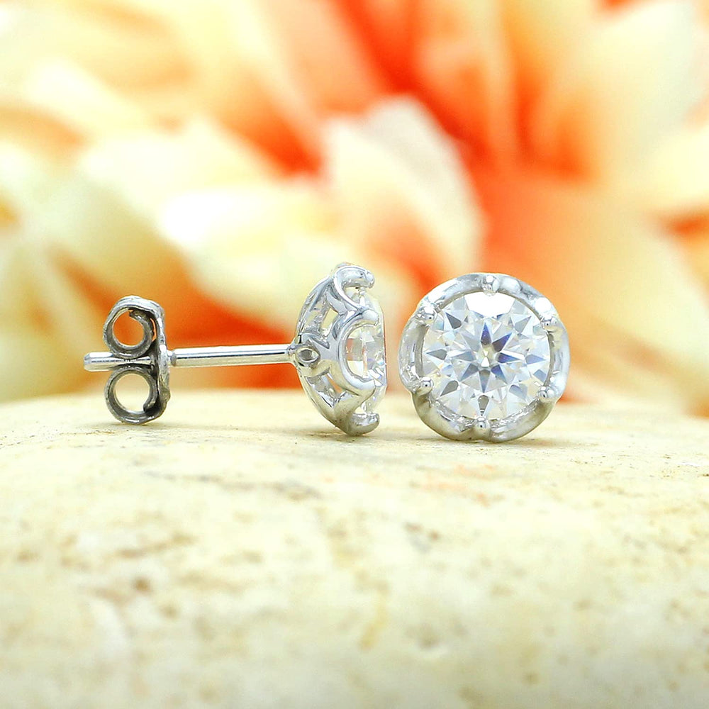 
                      
                        1 1/5 Carat 5.5MM Round Cut Lab Created Moissanite Diamond Push Back Stud Earrings In 925 Sterling Silver (1.20 Cttw)
                      
                    