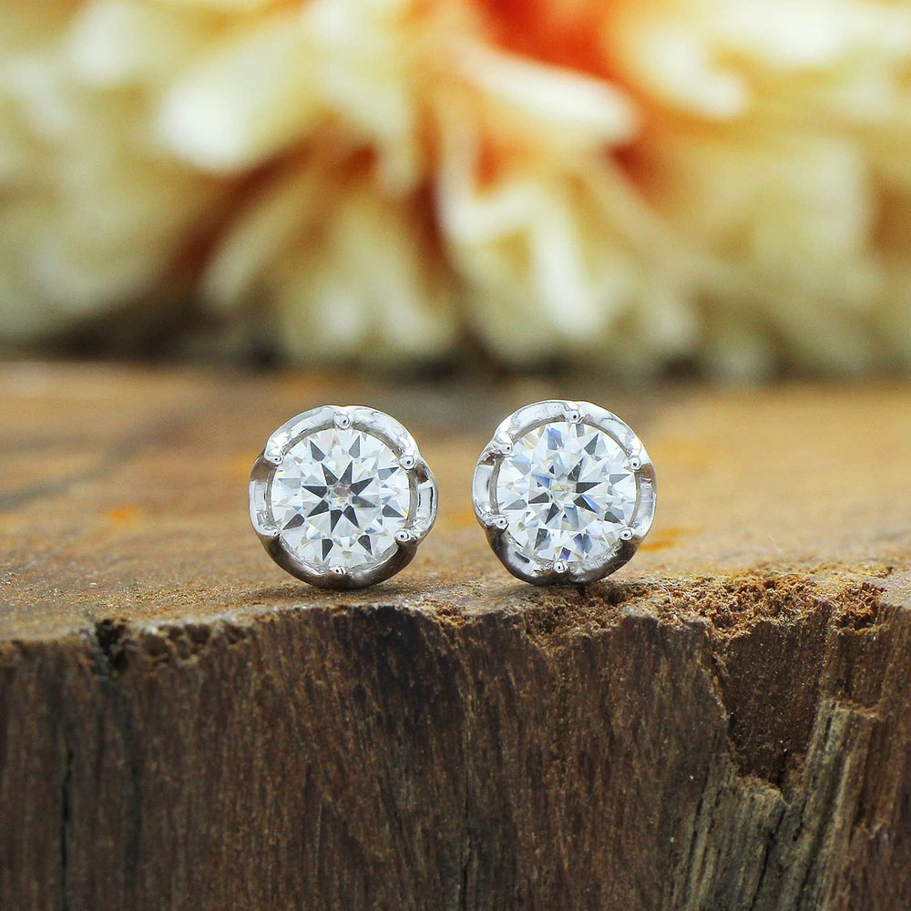 
                      
                        1 1/5 Carat 5.5MM Round Cut Lab Created Moissanite Diamond Push Back Stud Earrings In 925 Sterling Silver (1.20 Cttw)
                      
                    