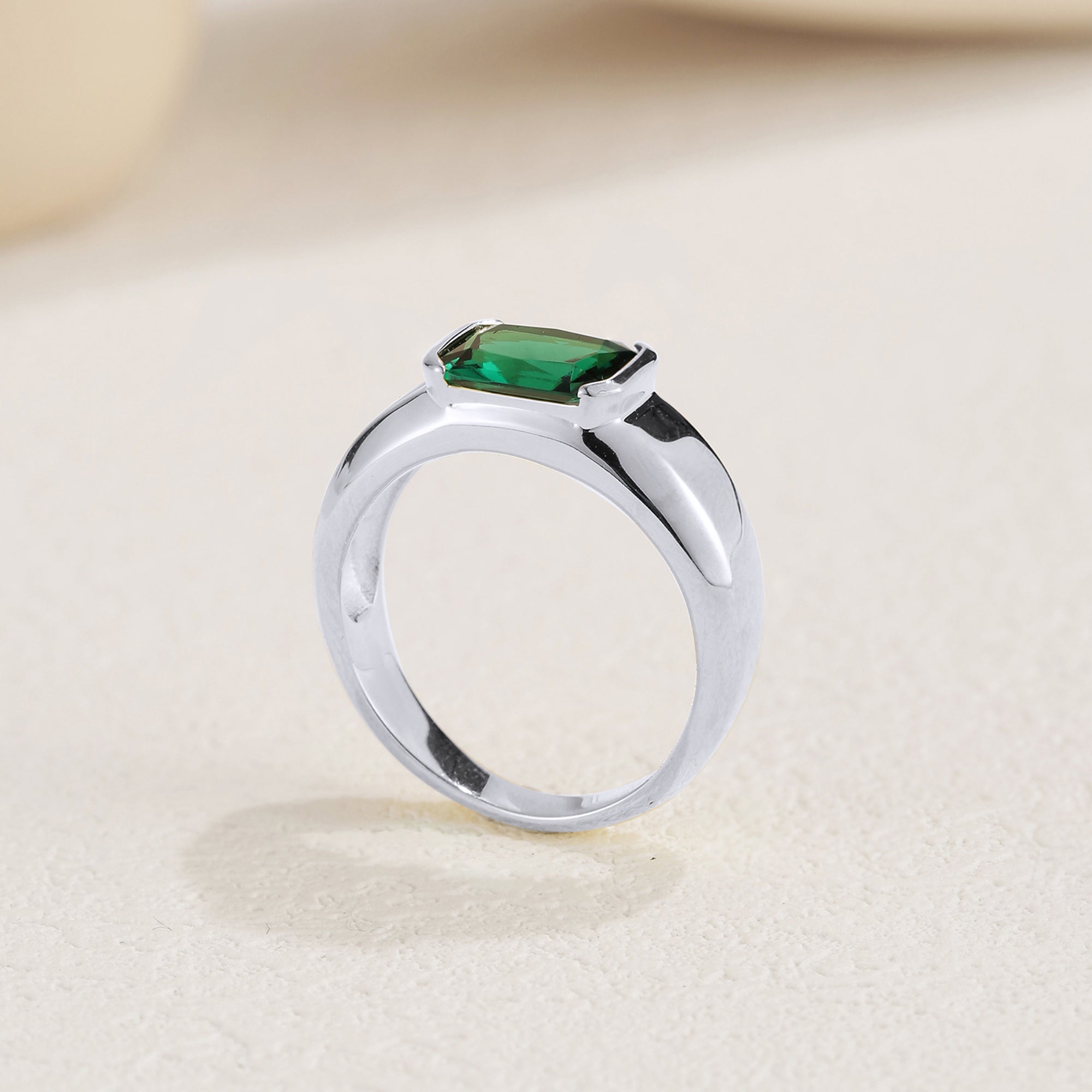 Isa Emerald Solitaire Engagement Ring