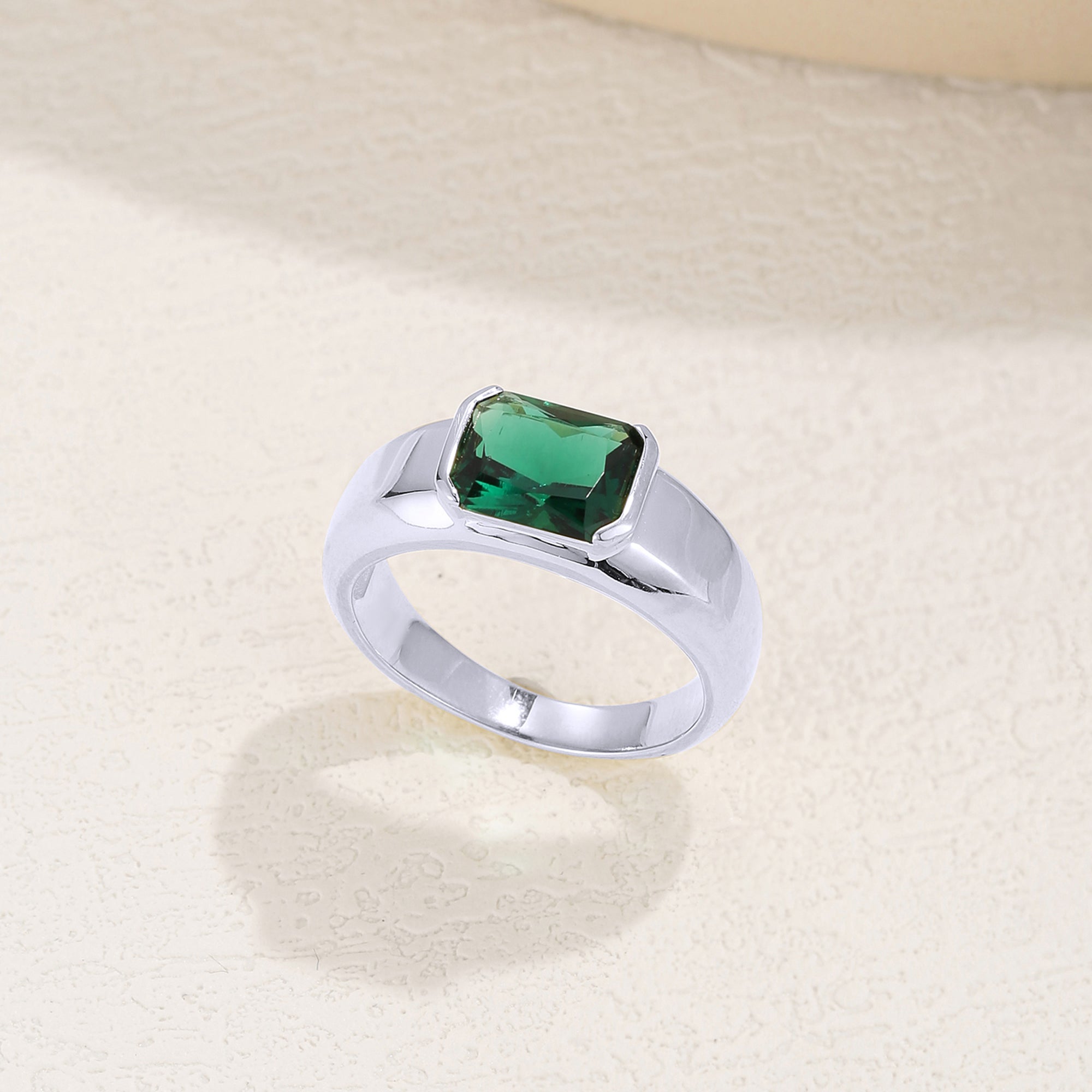 Isa Emerald Solitaire Engagement Ring