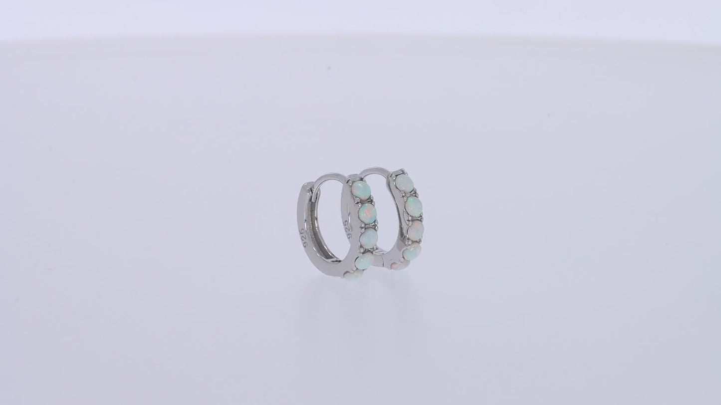 Load and play video in Gallery viewer, Round Cut Created Opal Gemstone Huggie Hoop Earrings For Women In 925 Sterling Silver
