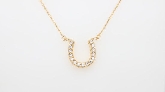 Load and play video in Gallery viewer, Round Cut White Cubic Zirconia Horseshoe Pendant Necklace For Women In 925 Sterling Silver
